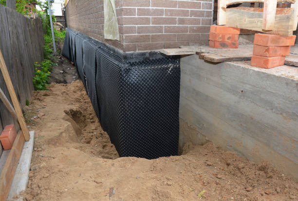 SJ Waterproofing Pros technician performing targeted Interior Drainage System assessment in Milltown, NJ